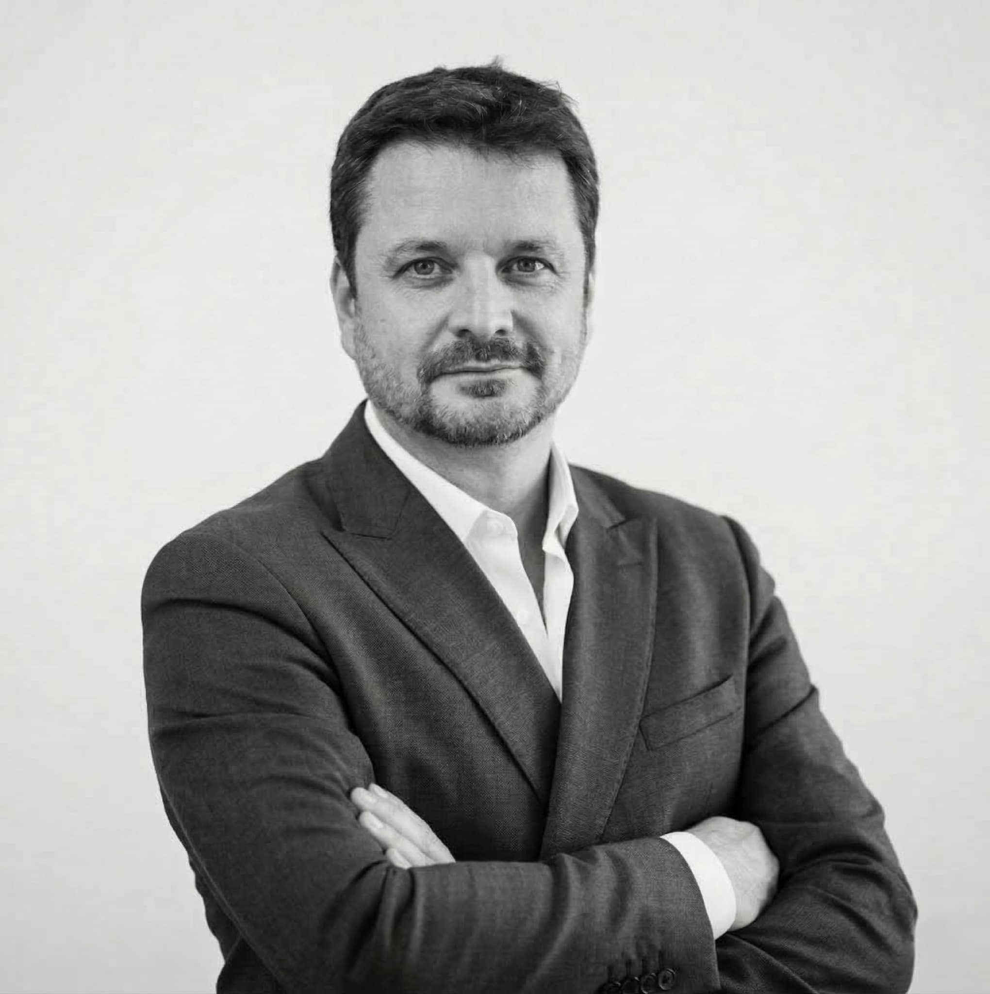 Professional businessman in Paris in dark suit confident and smiling face you real estate agency.